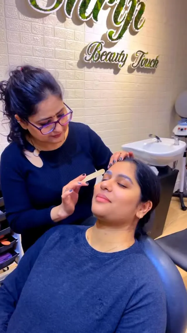 Eyebrow threading in progress