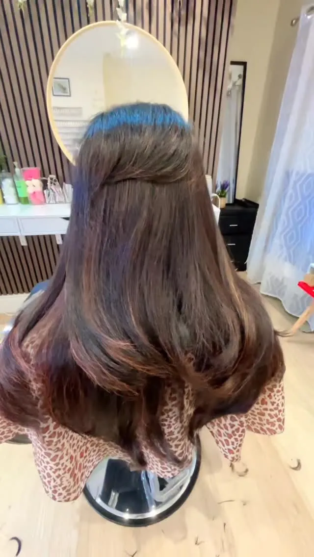 Long, glossy hair styled and finished