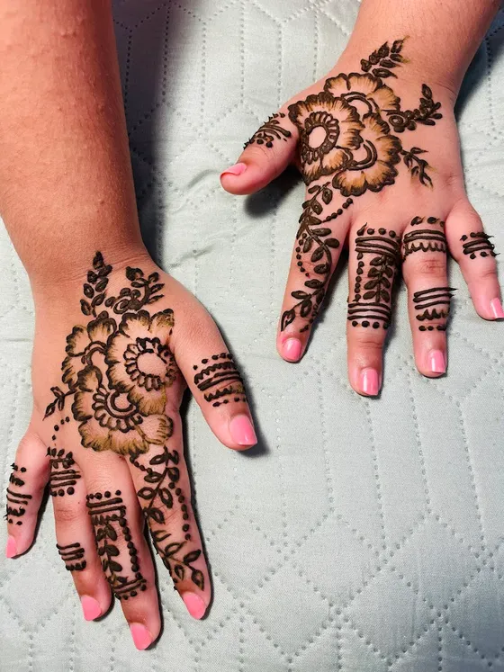 Intricate henna designs on the hands