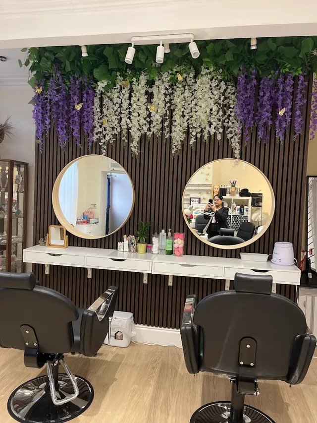 The wisteria wall and styling stations inside the salon