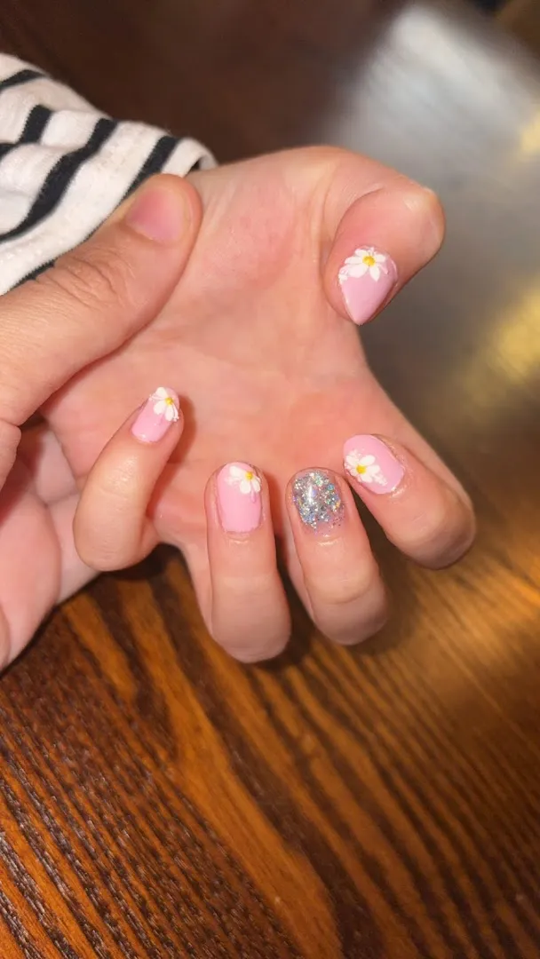 Nude nails with a glitter accent
