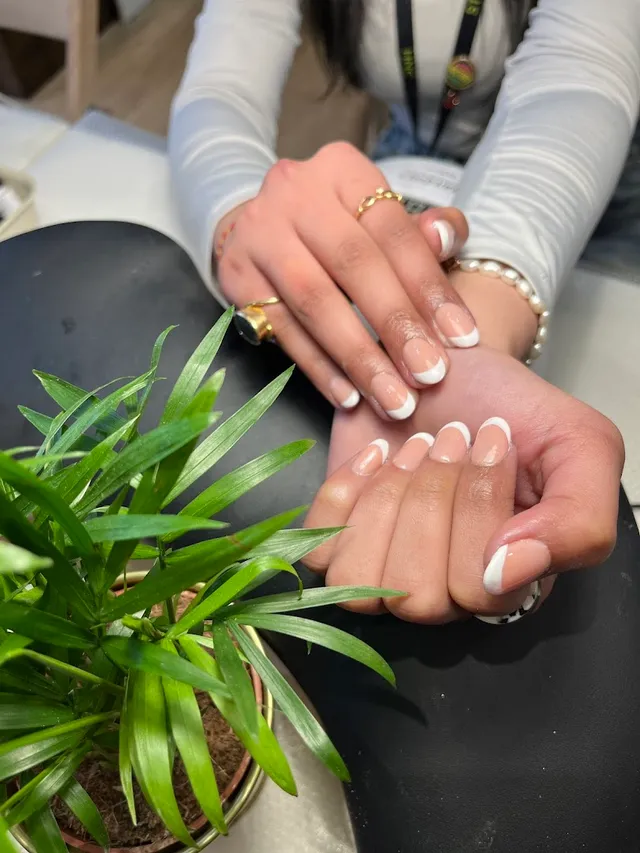 Neat nude manicure with greenery